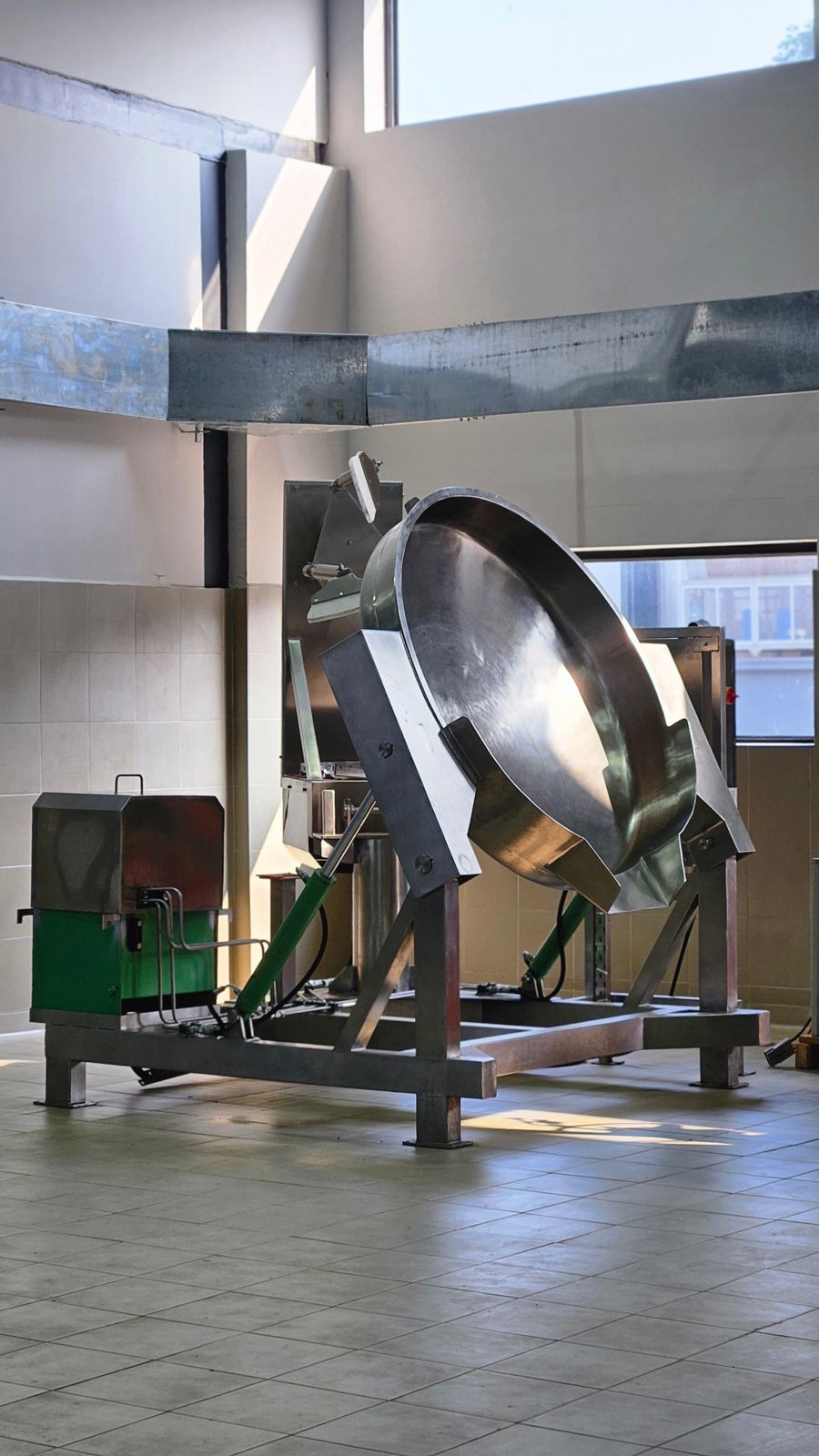 Commercial tilting cooking vessel used during scale-up of a shelf-stable food system.